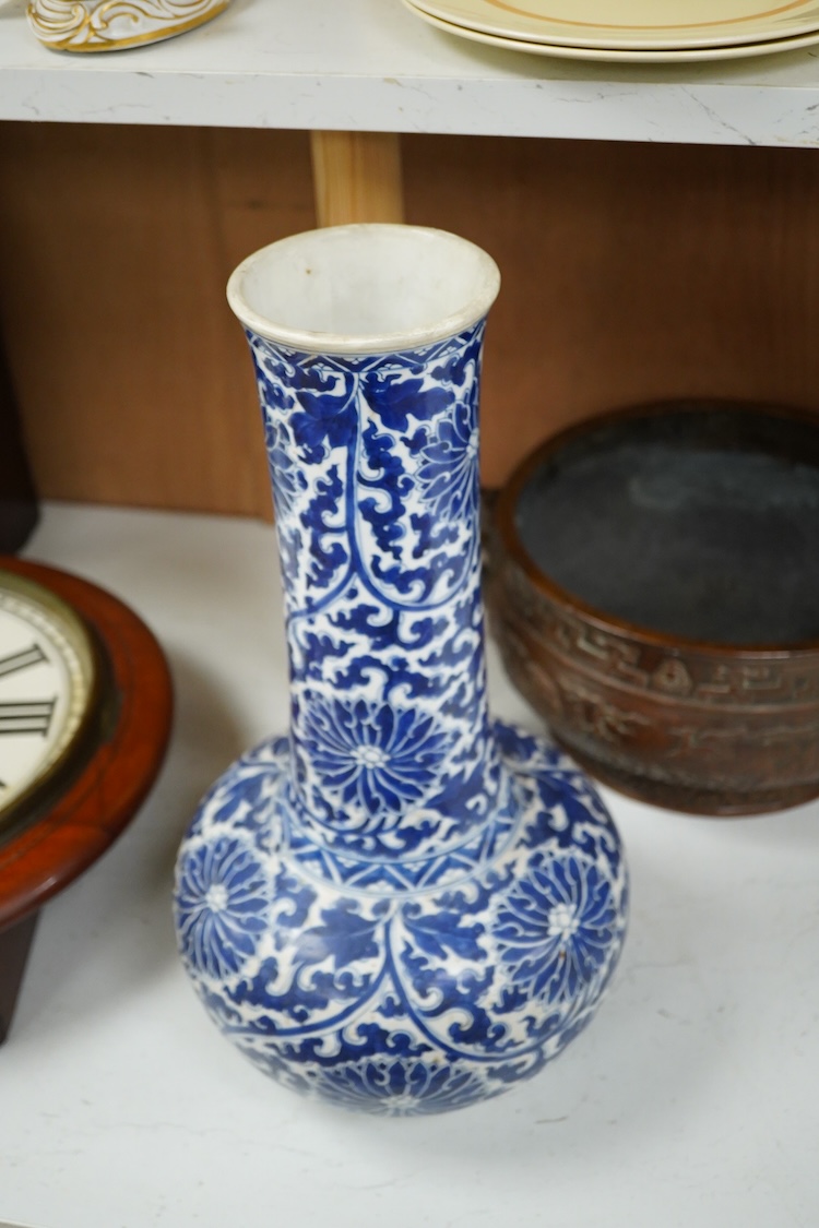 A Chinese blue and white bottle vase with lotus decoration, restored, Kangxi Period, 44cm high